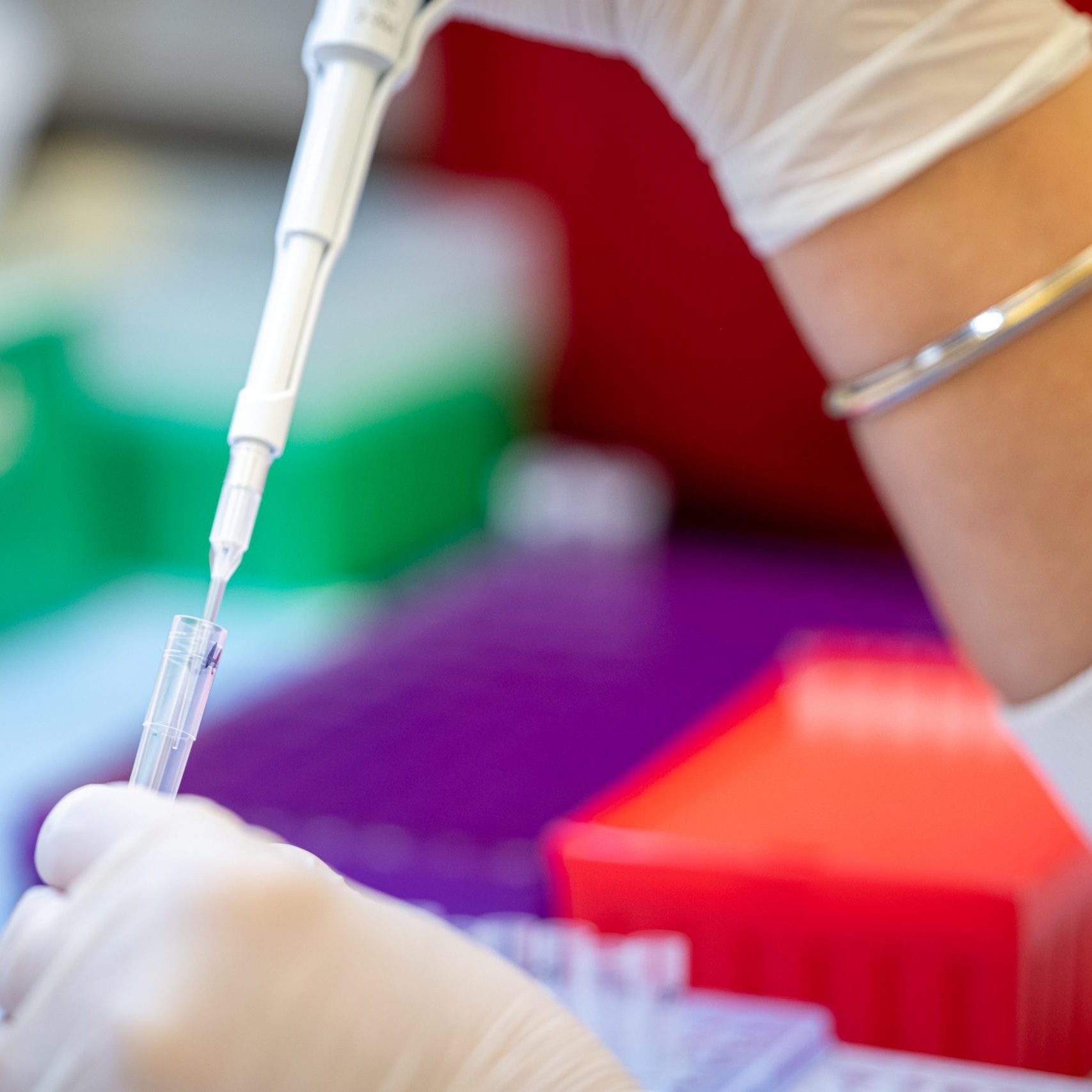 Scientist filling pipette